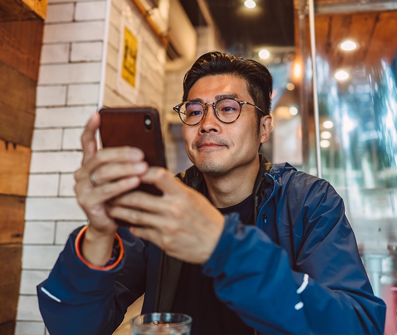 A man staring at his phone.