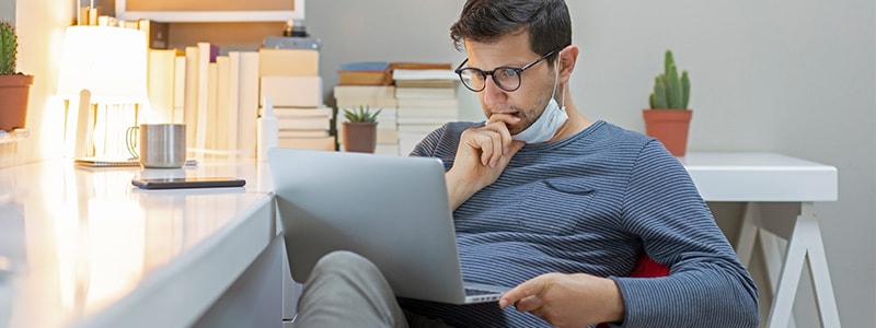 A man reading about how to protect himself from DocuSign phishing email attacks.