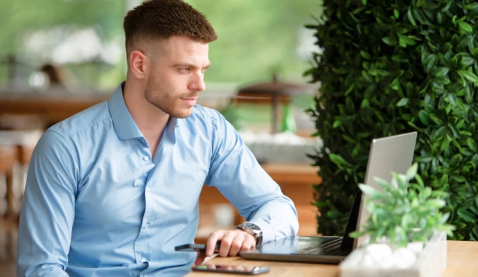 Man looing at Laptop.